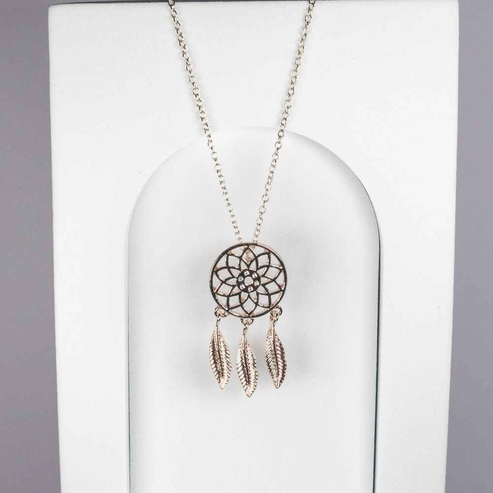 Silver dreamcatcher necklace with feather details displayed on white background.