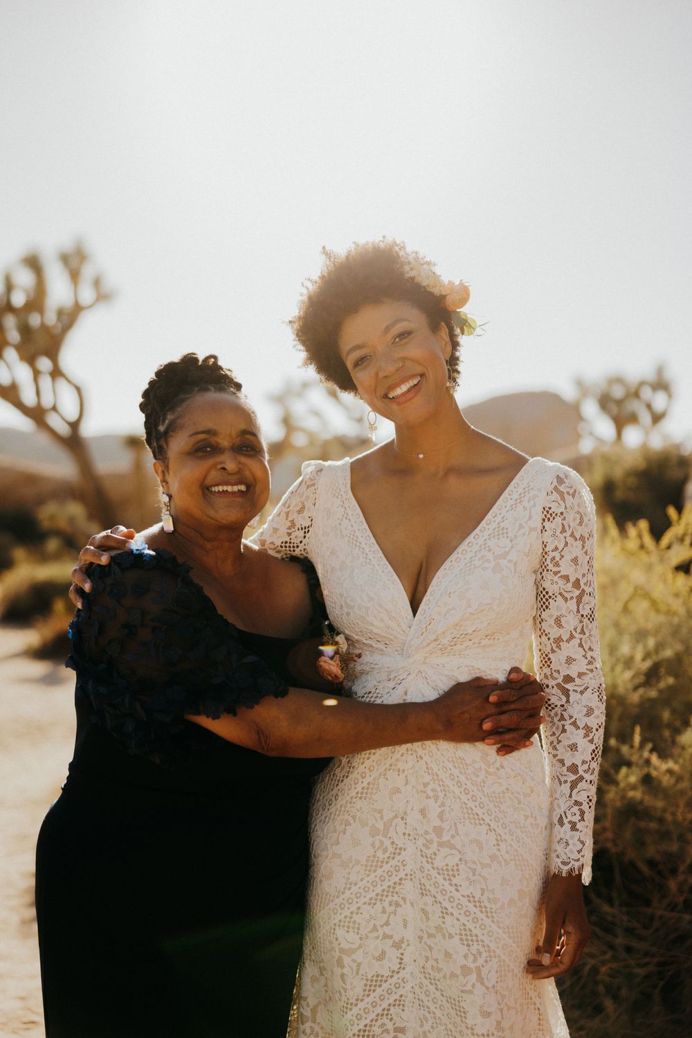 Candid moment of shared joy in a Joshua Tree National Park wedding setting.
