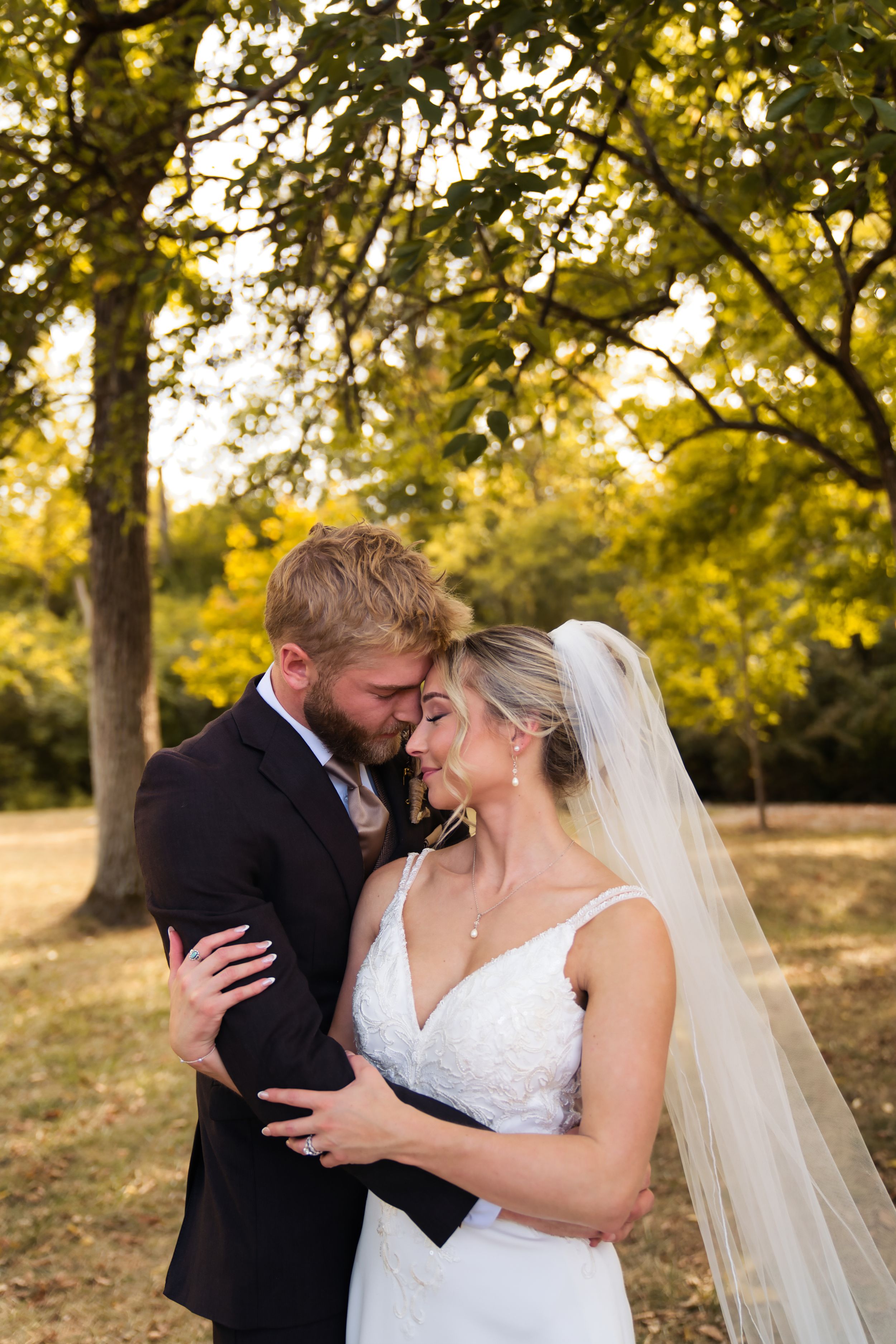 Bride & Groom couple's portraits on the wedding day in Miamisburg Ohio at golden hour sunset in the fall - Cincinnati Wedding Photographer