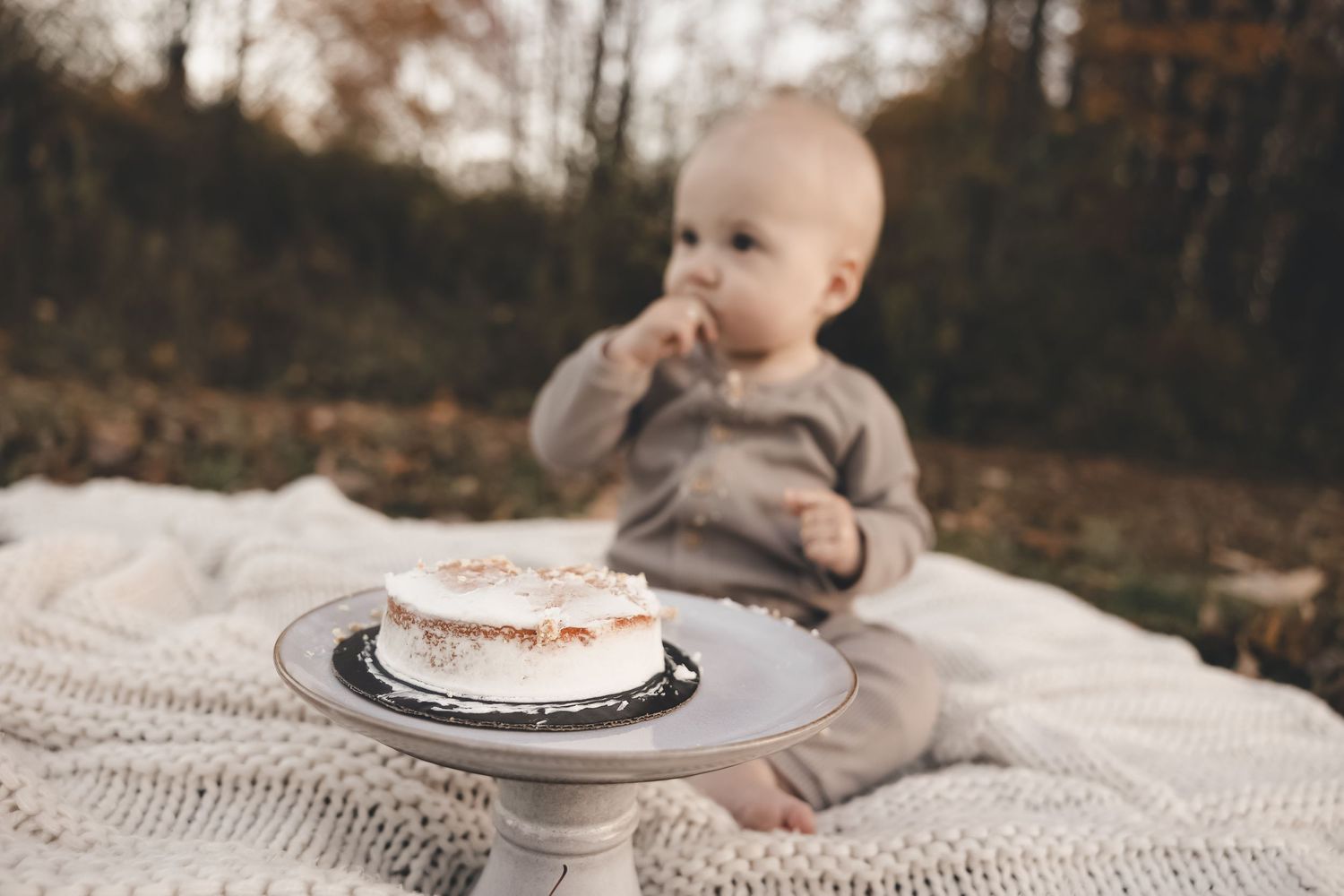 First birthday cake smash in Northeast Ohio. Natural, candid baby milestone photography capturing pure joy and timeless memories.