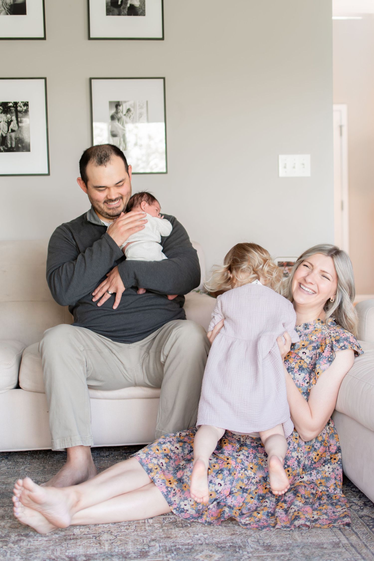 Hugs all around for this family in their living room.