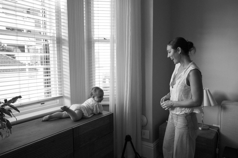 Silhouetted figures by window light in a series of connected interior photographs.