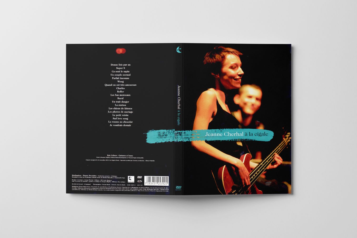 Back cover of music album showing track listing and performance photo on black background.