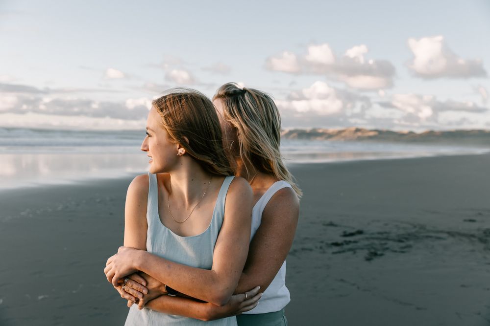 Family photo on the beach in sunset