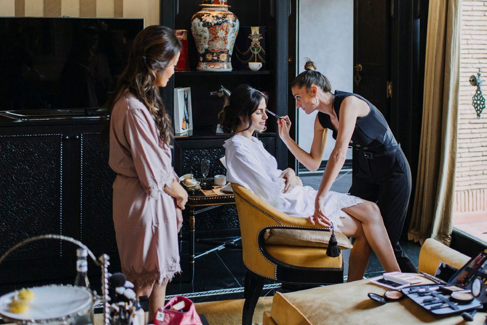 Behind the scenes photo of getting makeup and hair done in a vintage-style beauty salon setting.