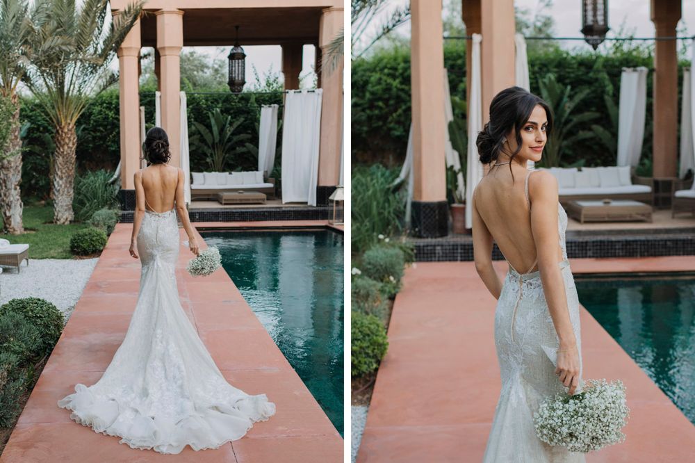 Elegant backless lace wedding dress with mermaid silhouette and train shown beside a luxurious pool with tropical landscaping.