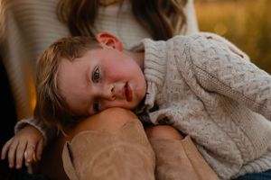 Collage of candid portrait photos showing warm expressions and cozy sweaters in golden autumn lighting.