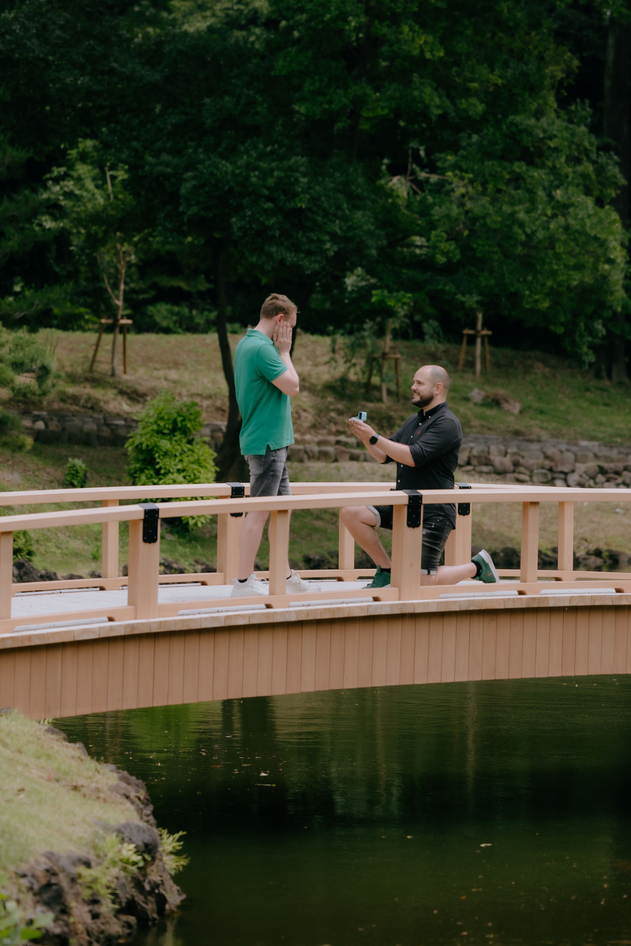 A romantic LGBTQ gap couple proposal photography at Shinjuku Gyoten national garden in Tokyo