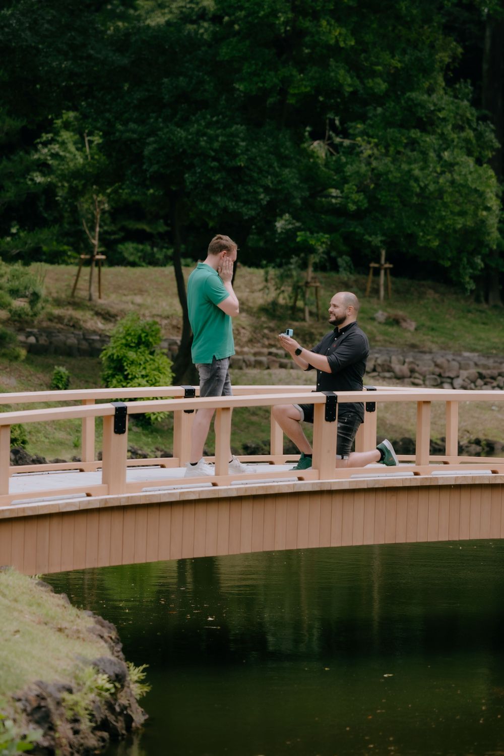 A romantic LGBTQ gap couple proposal photography at Shinjuku Gyoten national garden in Tokyo