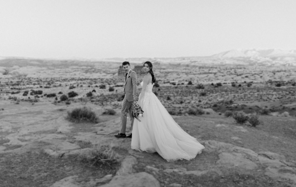 A black and white desert landscape wedding portrait with sweeping views of the wilderness.