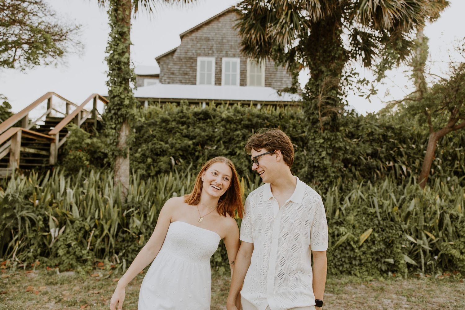 Golden Hour engagement photos of a couple with greenery at Dubois Park in Jupiter, Florida captured by Lindsay McDow Photography