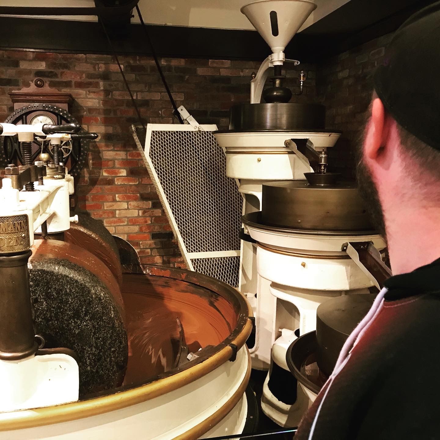 Antique chocolate making equipment displayed inside the historic Ghirardelli factory.