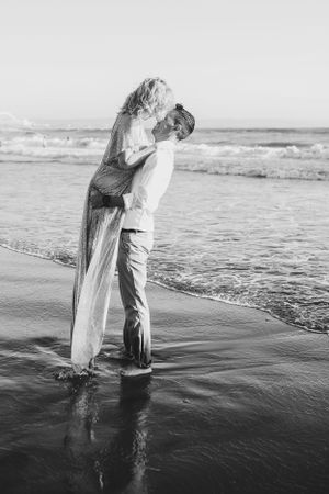 couple kissing in ocean