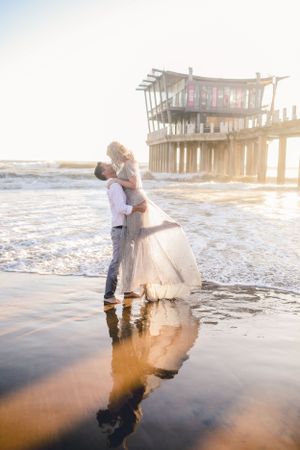 couple kissing in ocean