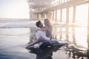 couple kissing in the ocean