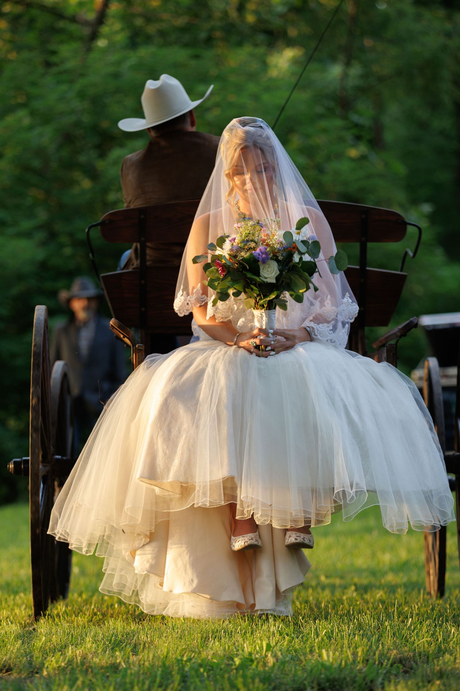Cowboy dips his new bride for a sweet kiss.