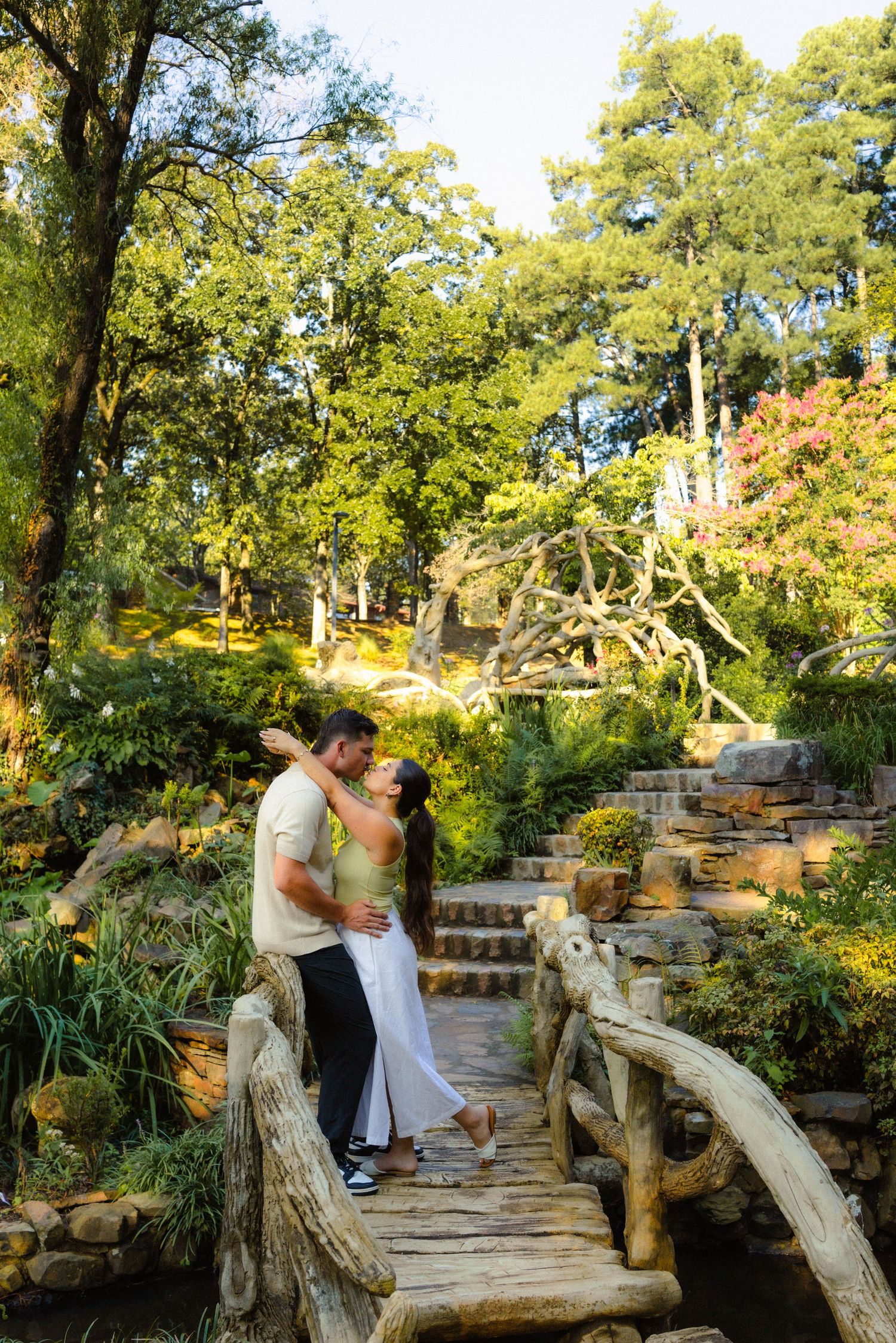 Newly Engaged Couple kiss after getting proposing and getting engaged at the Old MIll in Little Rock Arkansas