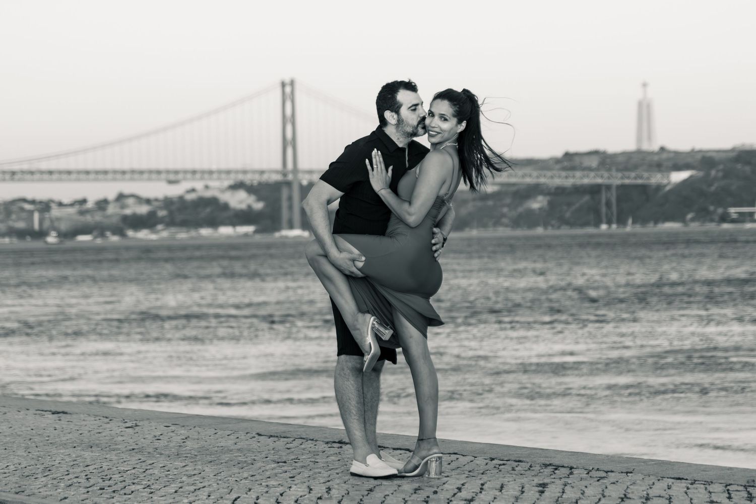 A series of black and white photographs showing silhouettes practicing yoga poses near the Golden Gate Bridge.