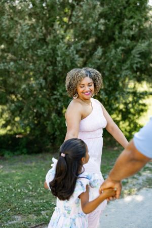 A joyful outdoor moment captured while dancing on a garden path.