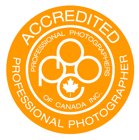 Orange circular logo for Professional Photographers of Canada Accreditation certification.