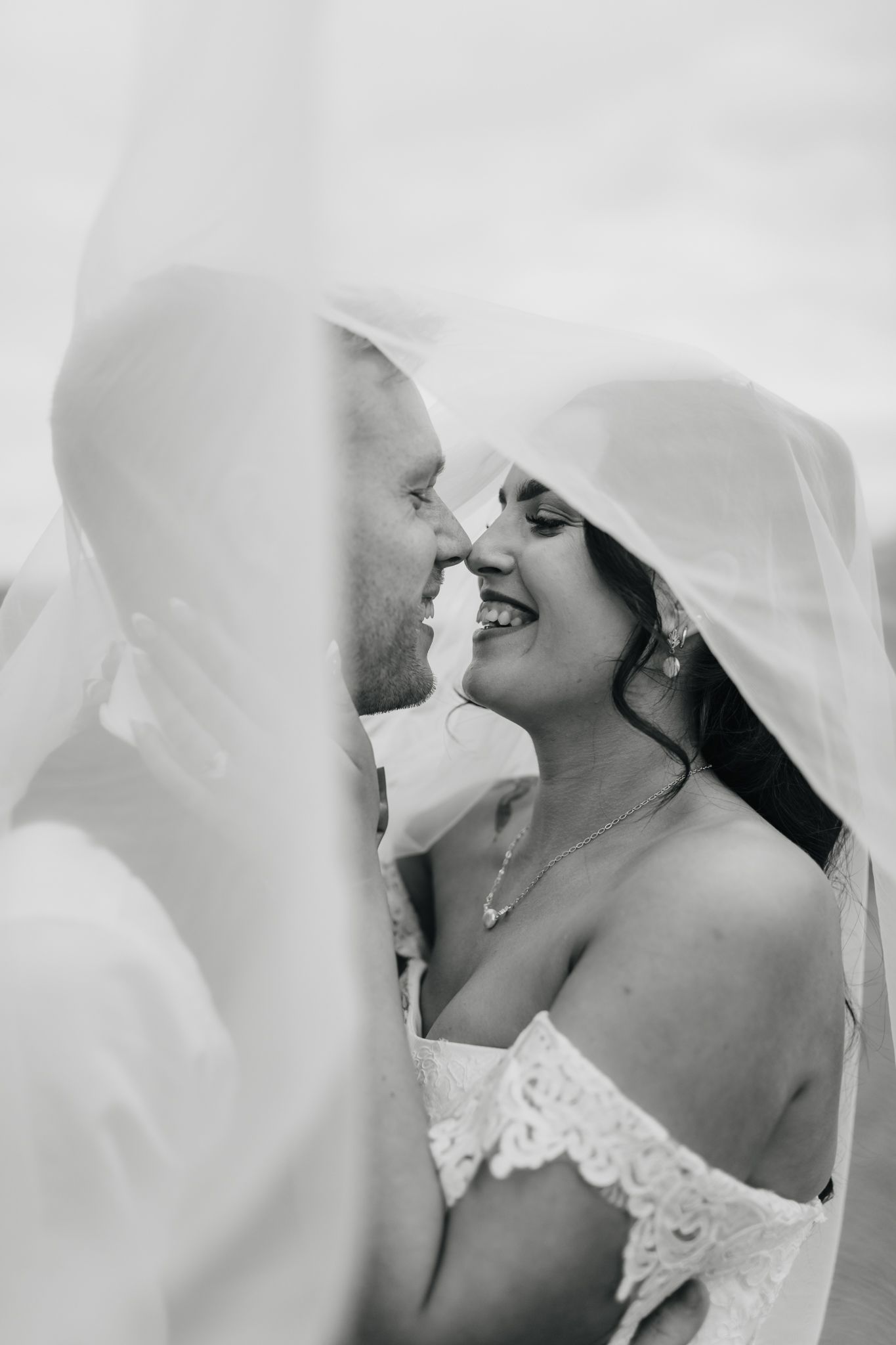 A romantic wedding photo collage with glimpses of tender moments under soft white veils.