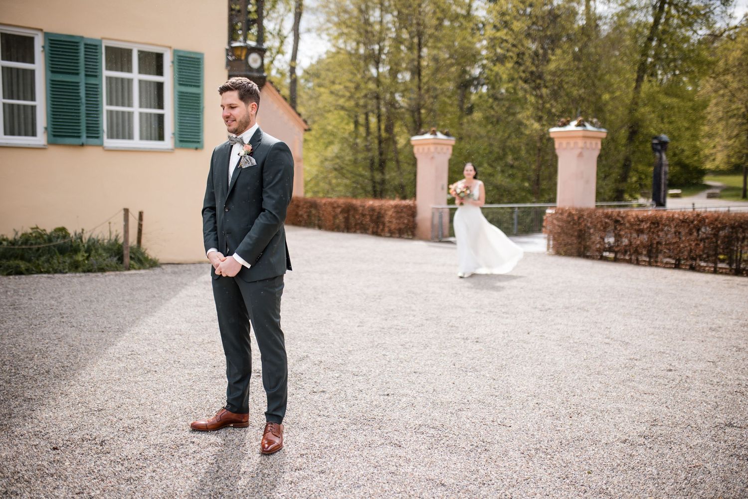 First look setup with couple waiting at castle entrance.