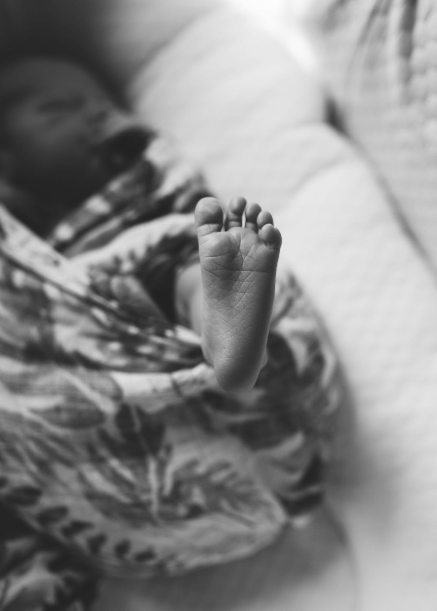 "Black and white newborn foot detail picture"