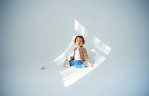 Bright natural light creating geometric shadows on minimalist white background.