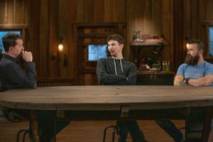 Three men seated at a large round wooden table in a rustic room with wood paneled walls.
Commercial Photography
Gold Rush
