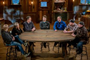 People gathered around a large round wooden table in rustic lodge-style room.
Commercial Photography
Gold Rush