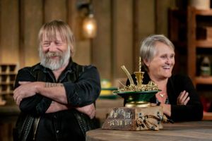 Two people posing with decorative trophy or model on wooden counter.
Commercial Photography
Gold Rush