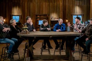 Group seated around large circular table having discussion in wood-paneled room.
Commercial Photography
Gold Rush