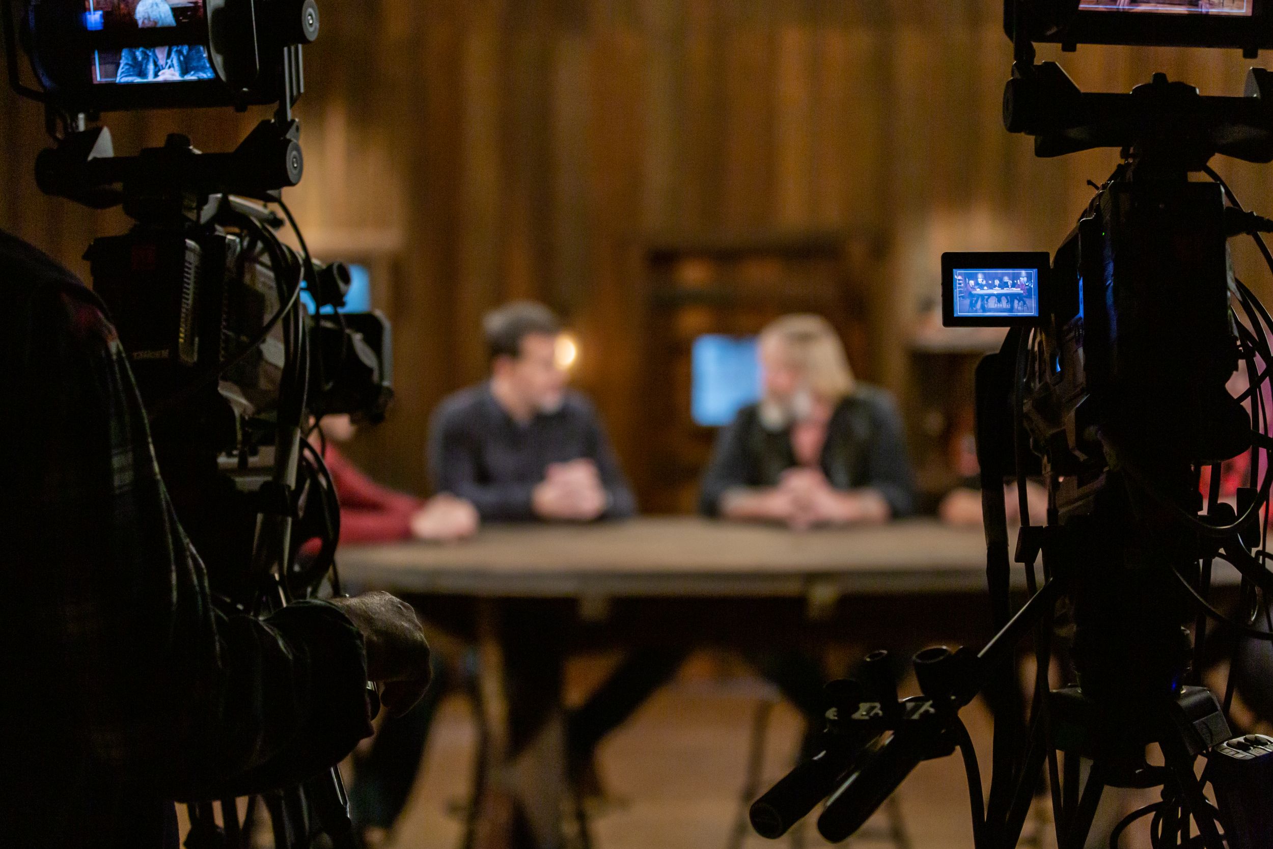 TV cameras frame a dimly lit interview setup at a wooden table in a rustic room.
Commercial Photography
Gold Rush