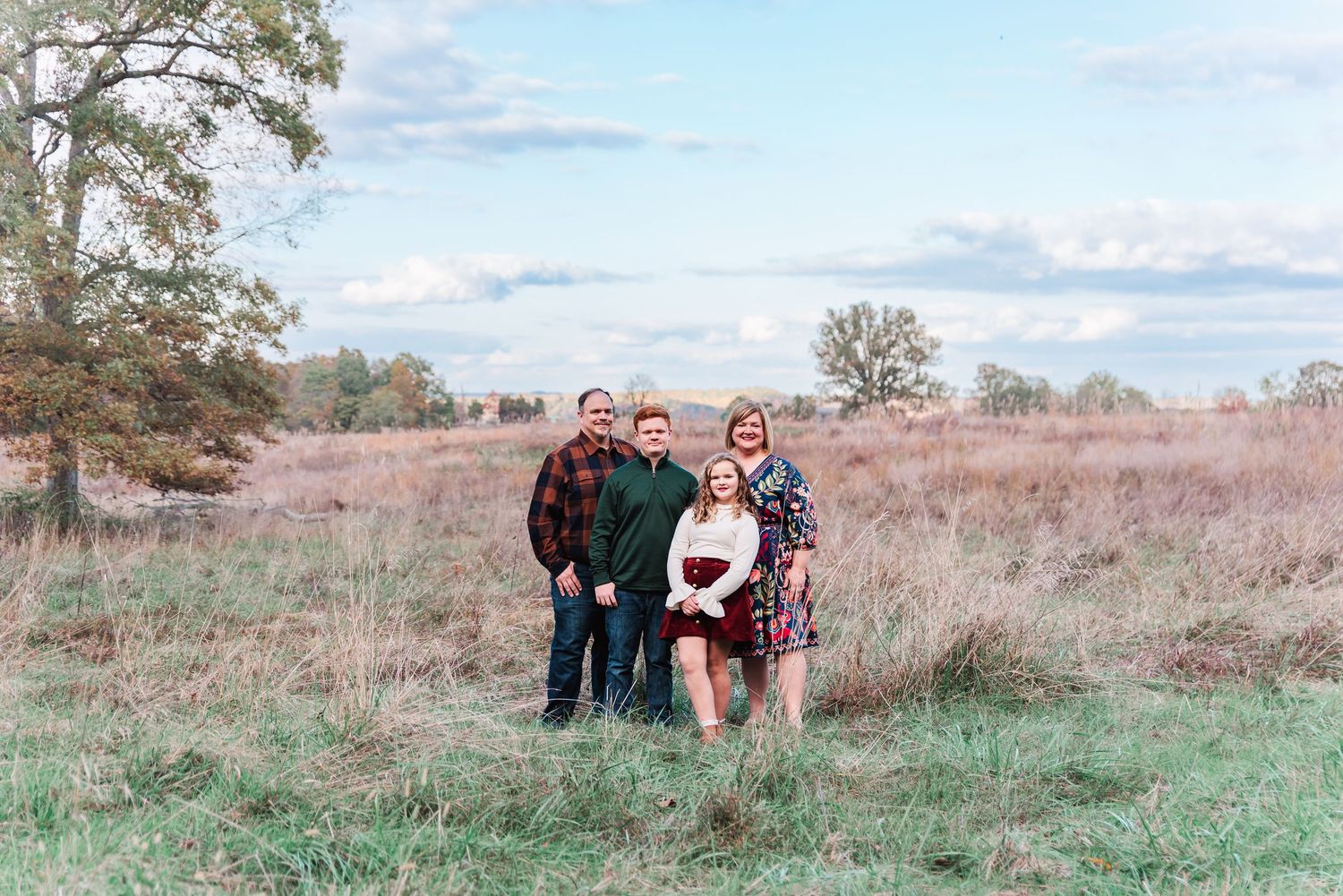 Family photography of a family with 2 children posing in Eddyville, Kentucky