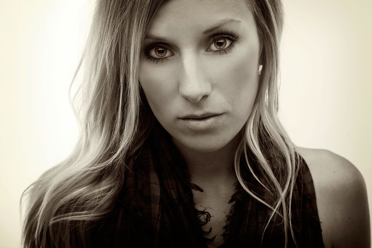 Close up artistic portrait with dramatic lighting highlighting textured details and contrast.