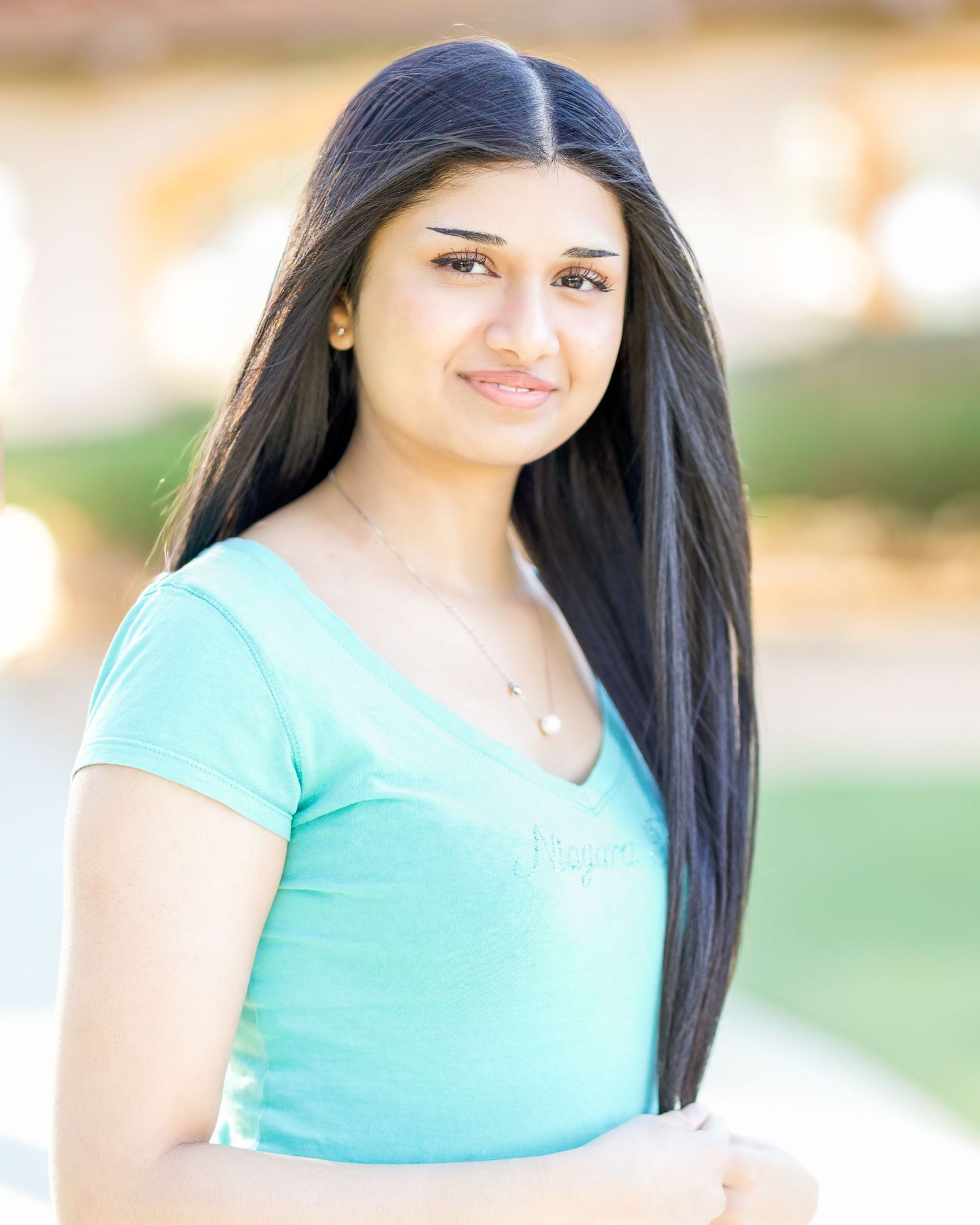 Professional Headshot for an inspiring actress using natural light. Professional Photographer is photographing model during night light.