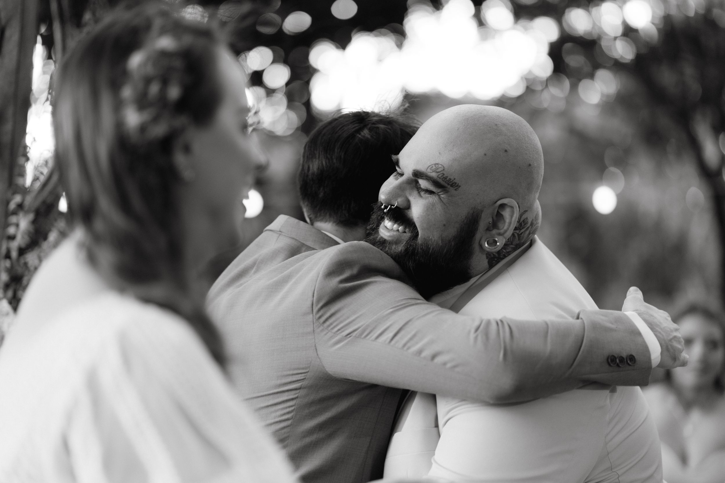 Intimate outdoor wedding moments captured between guests.