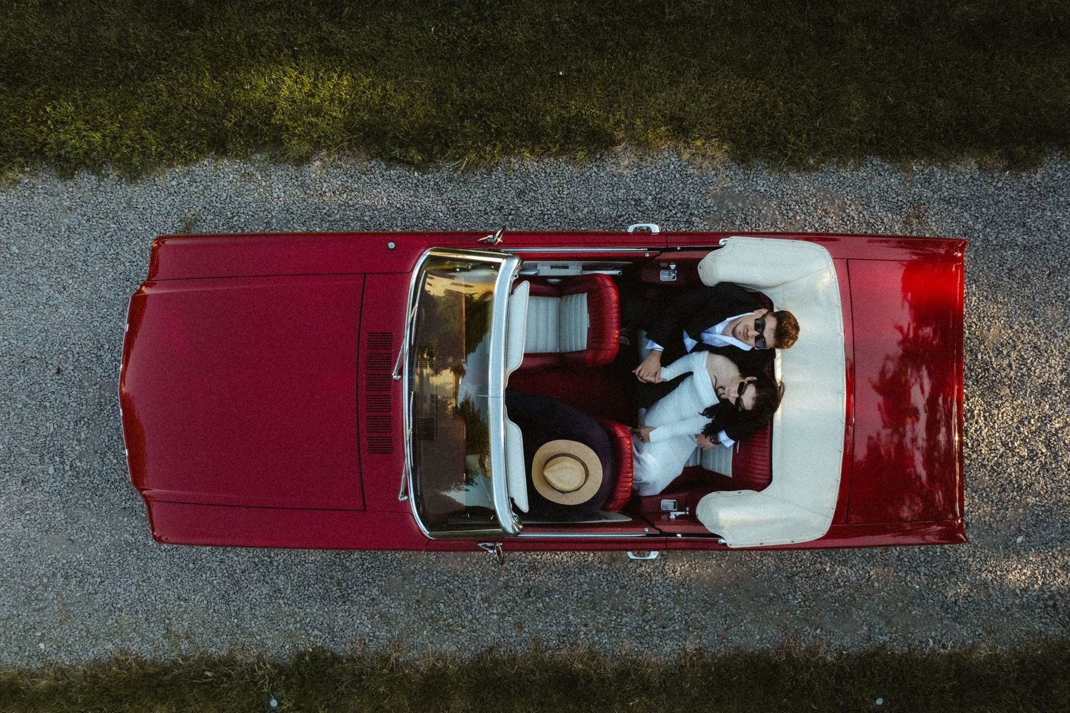 Grooms in a Mustang car