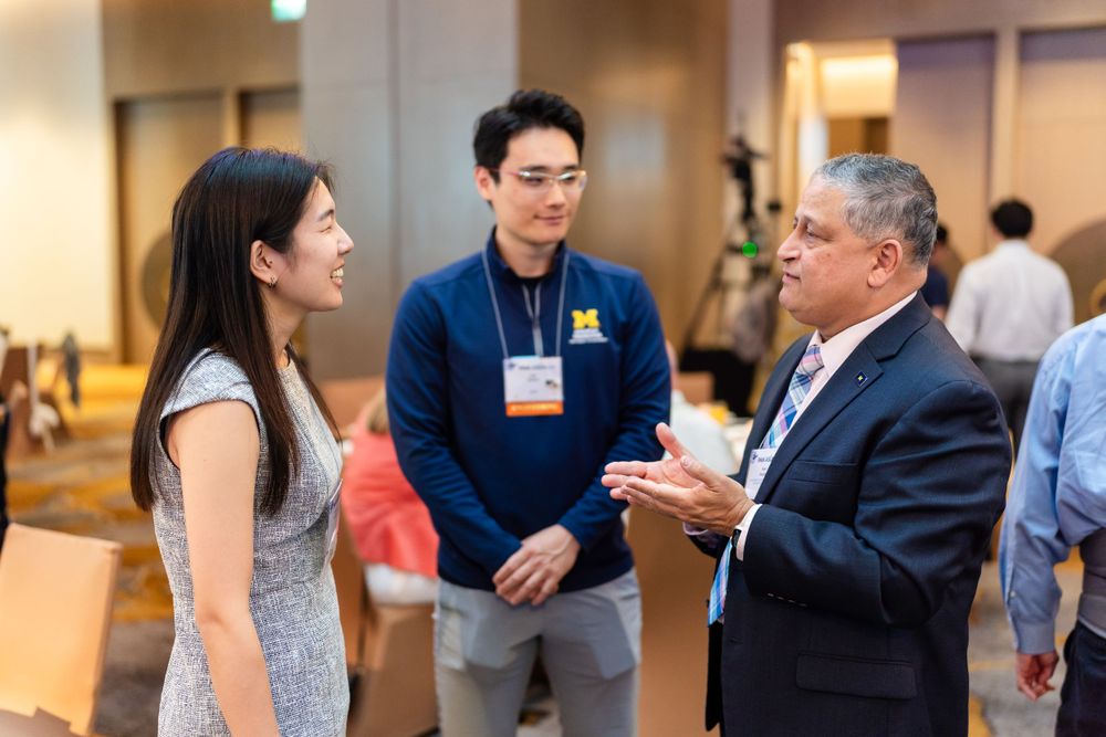 alumni chatting at conference at Le Méridien Taipei