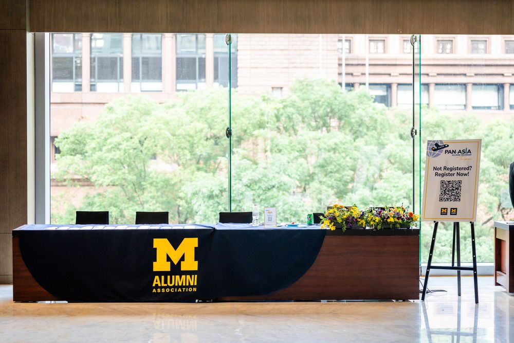 welcome booth for Michigan alumni at a conference in Le Méridien Taipei