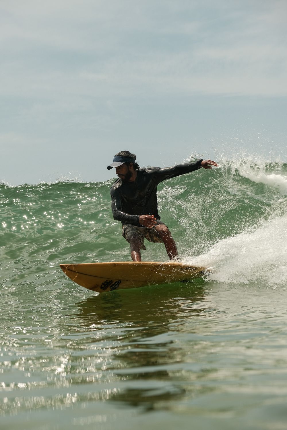 surfer making a bottom turn captured inside the water surf photography