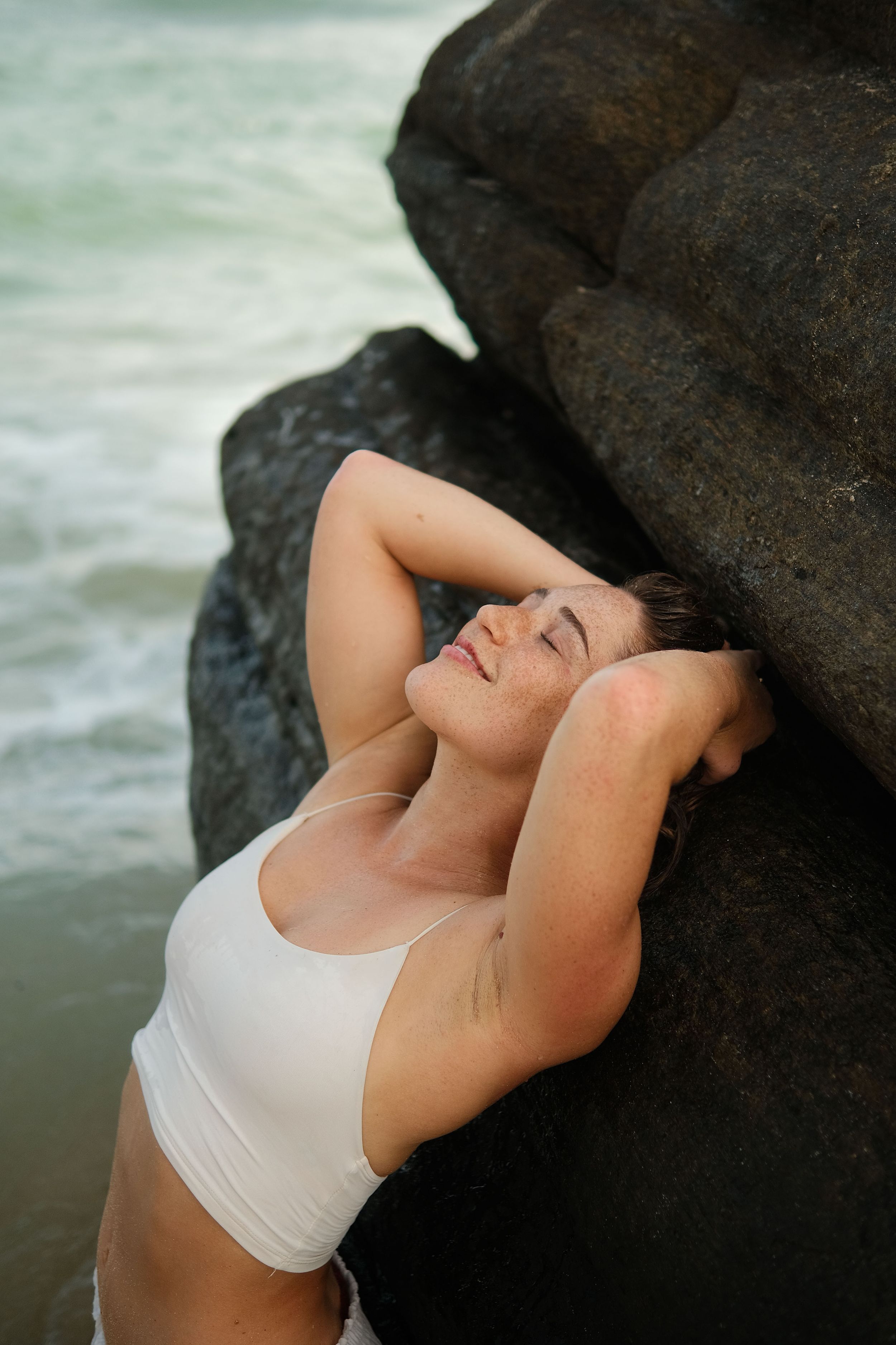 portrait girl ocean with rocks