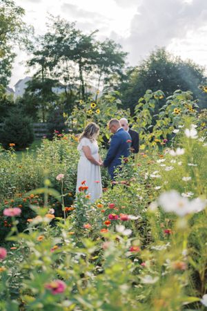 wedding day in a field of flowers near columbus ohio photographed by life by jude photography / judith sumner