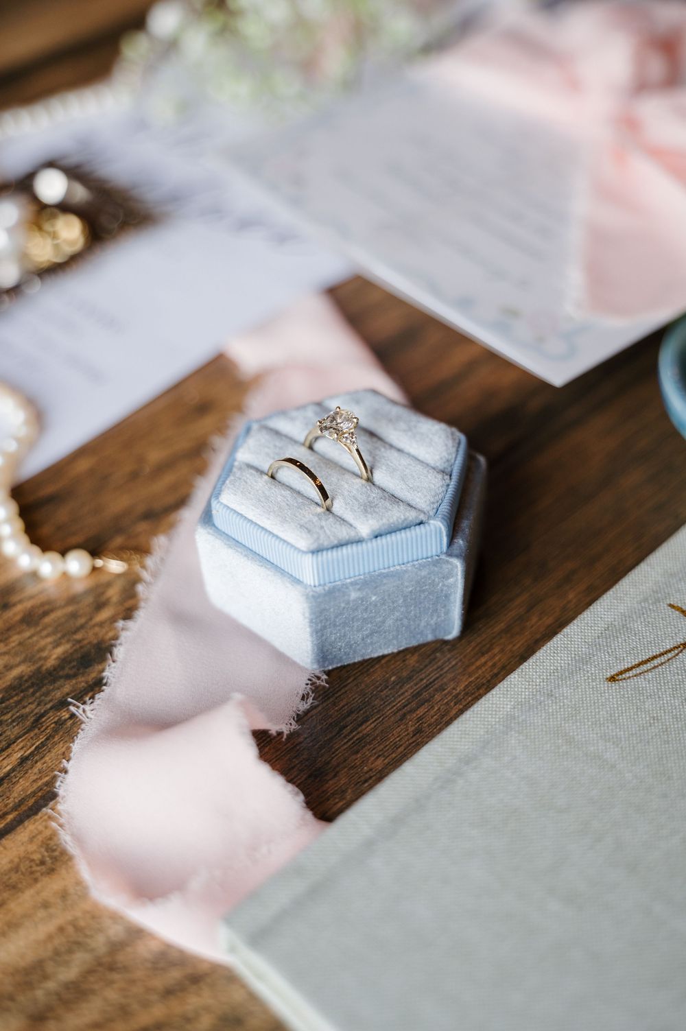 detail shot of vows and engagement rings
