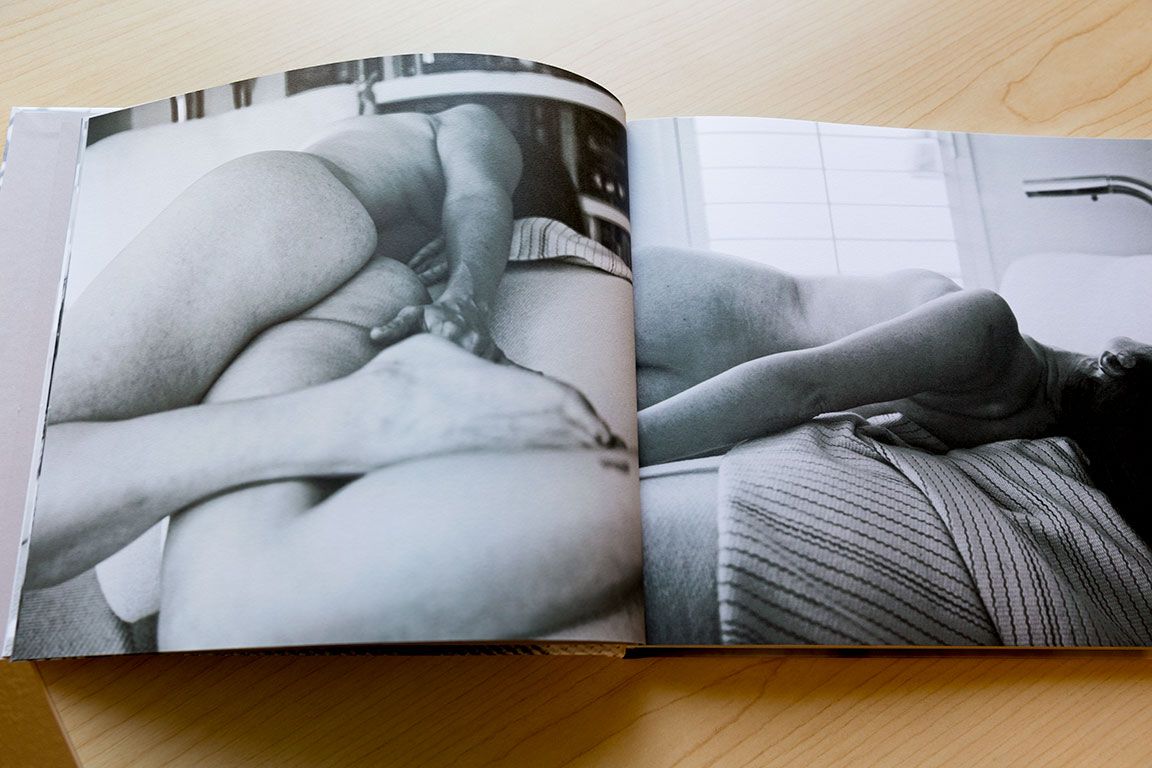 Intimate black and white photography book spread showing abstract body forms.