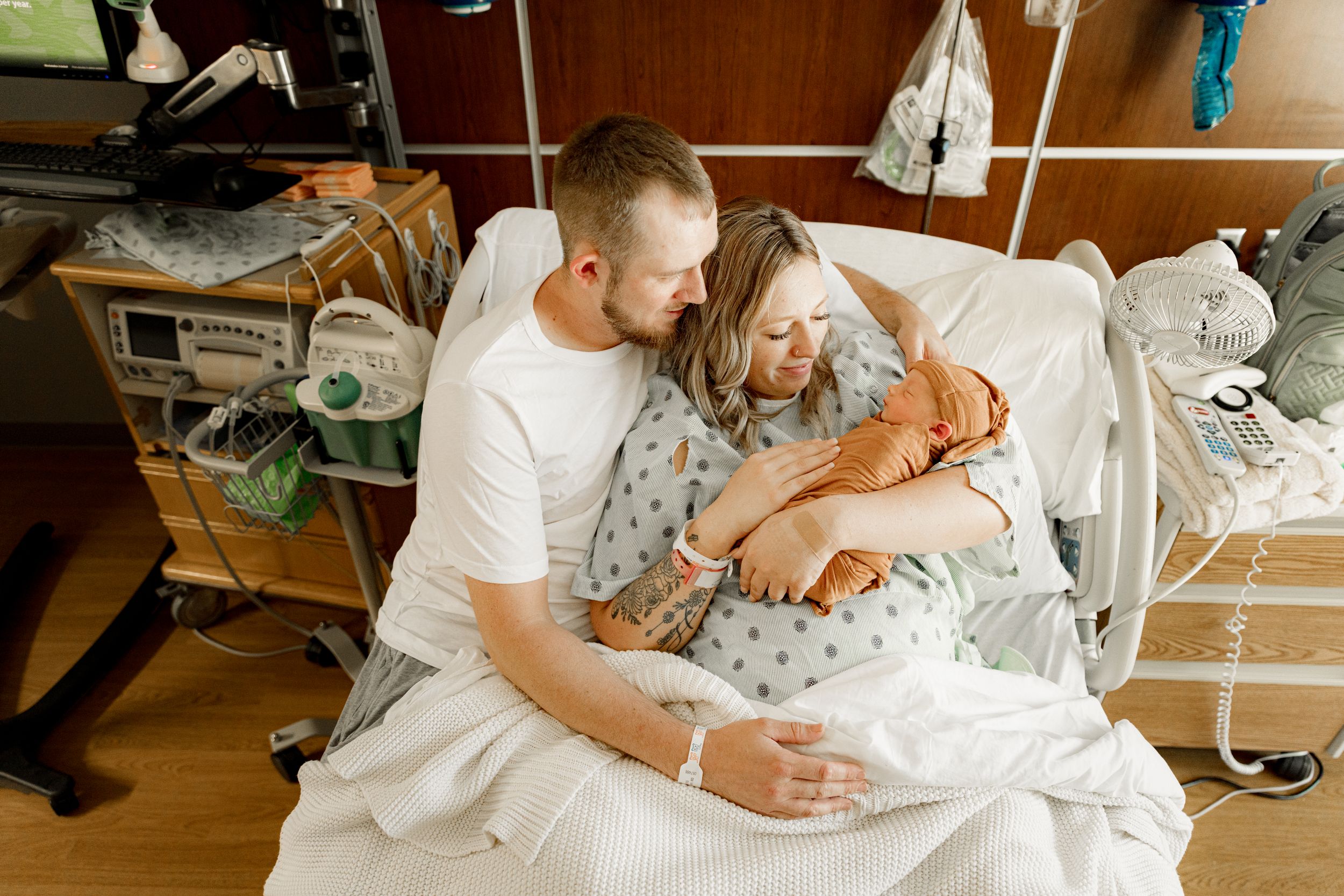 Family holding new baby during a Fresh 48 Hospital Newborn photography session in Marion Indiana