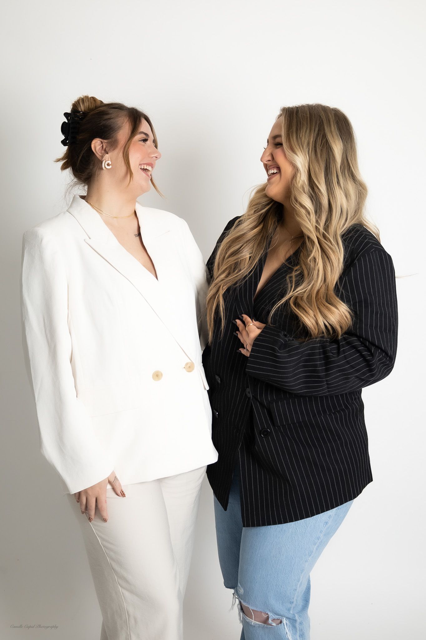 business partners laughing in studio, personal branding and portrait session for women by Camille Cupid Photography in Pittsburgh