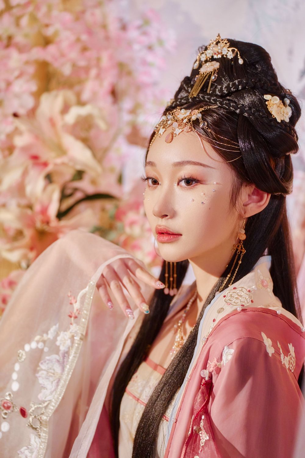 Glamorous pink Hanfu portrait featuring an amazing style, cold gaze, and light bamboo backdrop, captured by Imagine Image Studio.