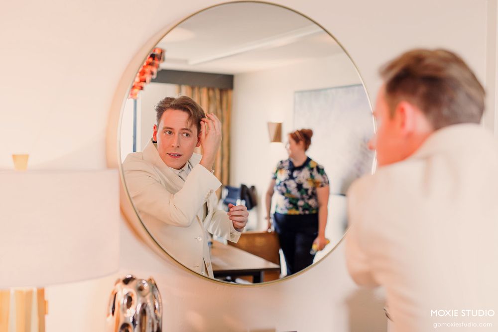 Series of artistic mirror reflections showing a person in formal white attire getting ready.