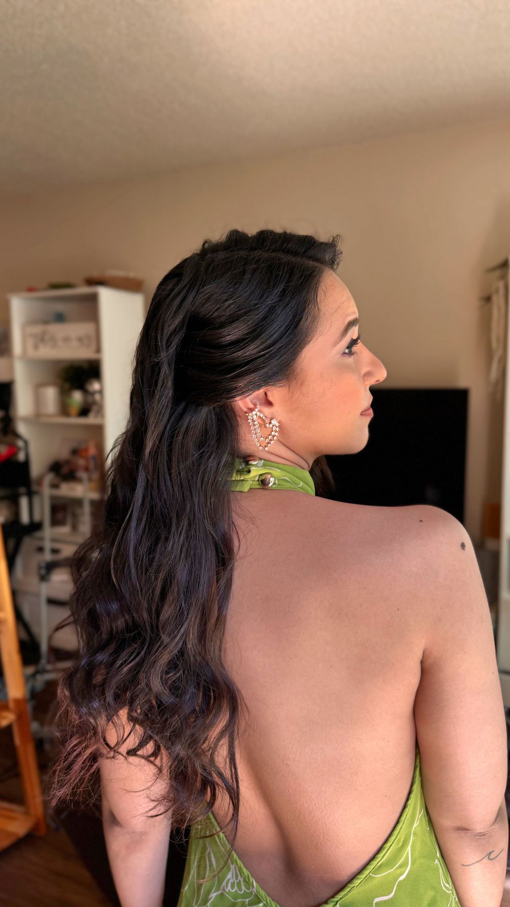 Back view showing intricate details of a lime green formal dress.